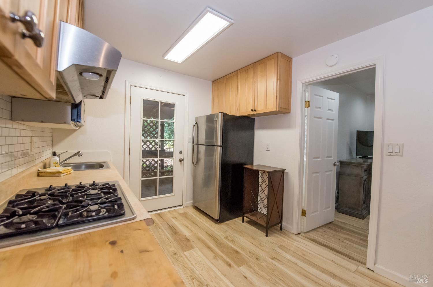 8650 Mirabel Road Forestville, CA 95436 - Photo 15 of 42 a kitchen with stainless steel appliances granite countertop a refrigerator and a stove