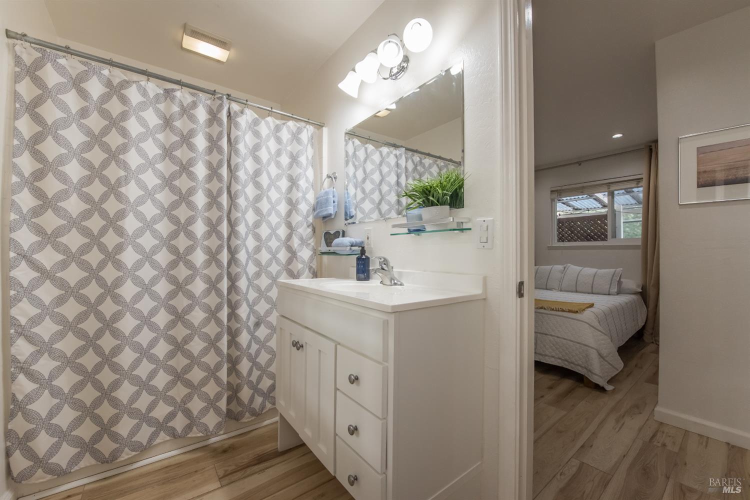 8650 Mirabel Road Forestville, CA 95436 - Photo 21 of 42 a en suite bathroom with a sink a mirror and a shower
