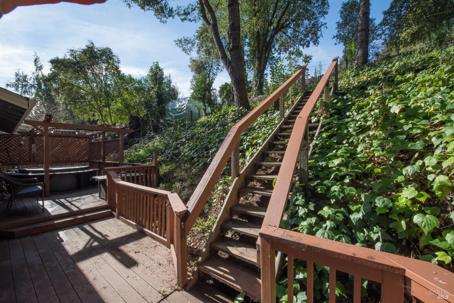8650 Mirabel Road Forestville, CA 95436 - Photo 32 of 42 a balcony with wooden floor and outdoor seating
