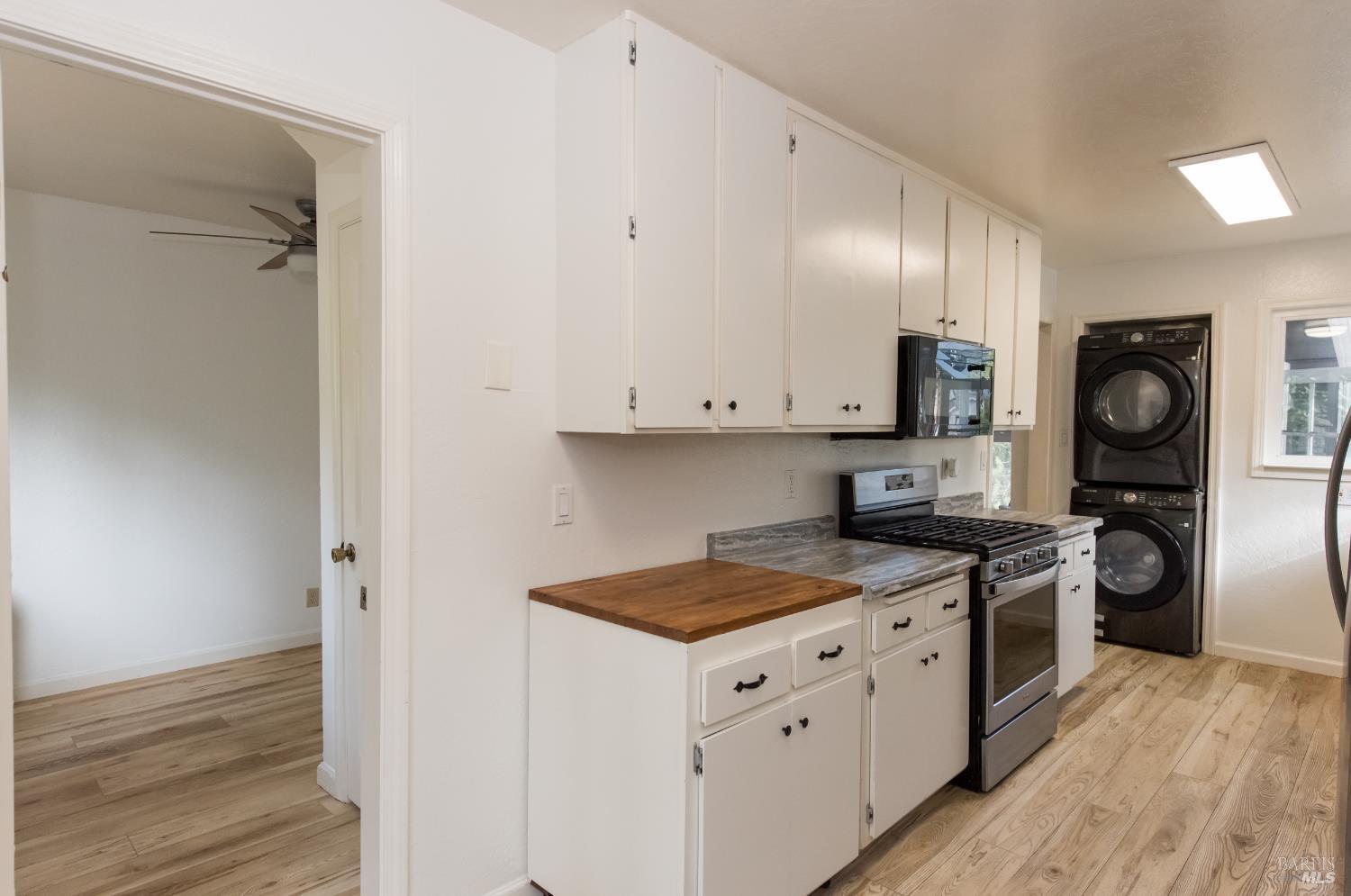 8650 Mirabel Road Forestville, CA 95436 - Photo 35 of 42 a kitchen with stainless steel appliances granite countertop a stove a sink and a refrigerator