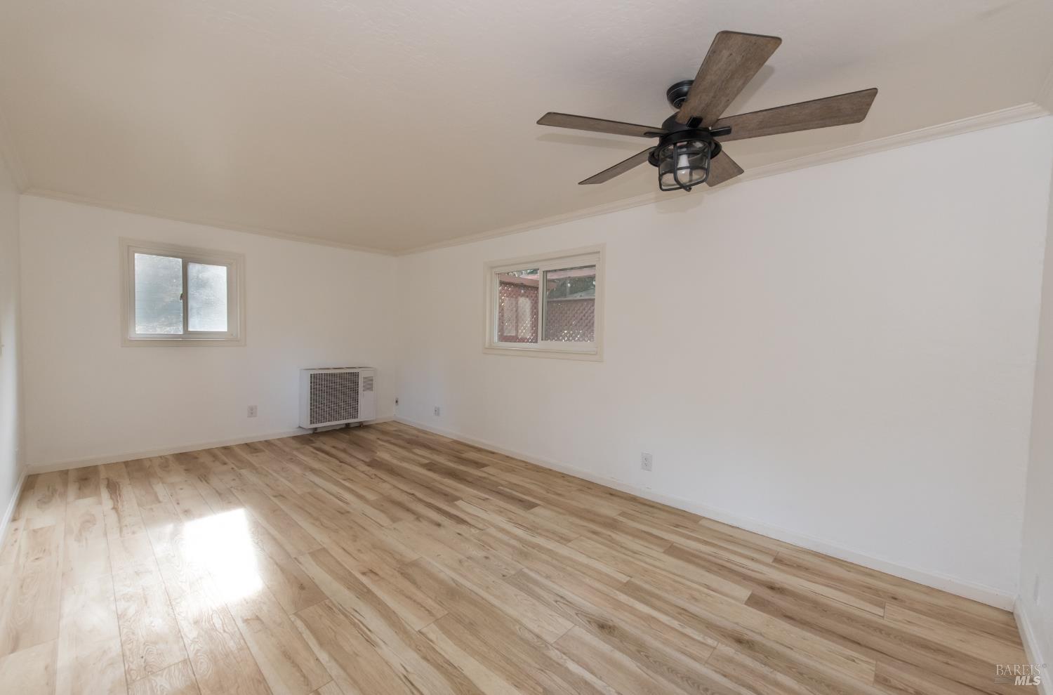 8650 Mirabel Road Forestville, CA 95436 - Photo 38 of 42 wooden floor in an empty room with a window