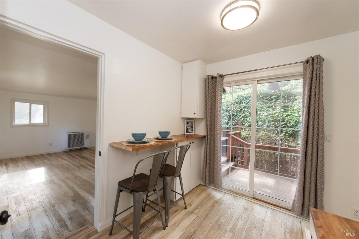 8650 Mirabel Road Forestville, CA 95436 - Photo 9 of 42 a workspace with wooden floor and a window