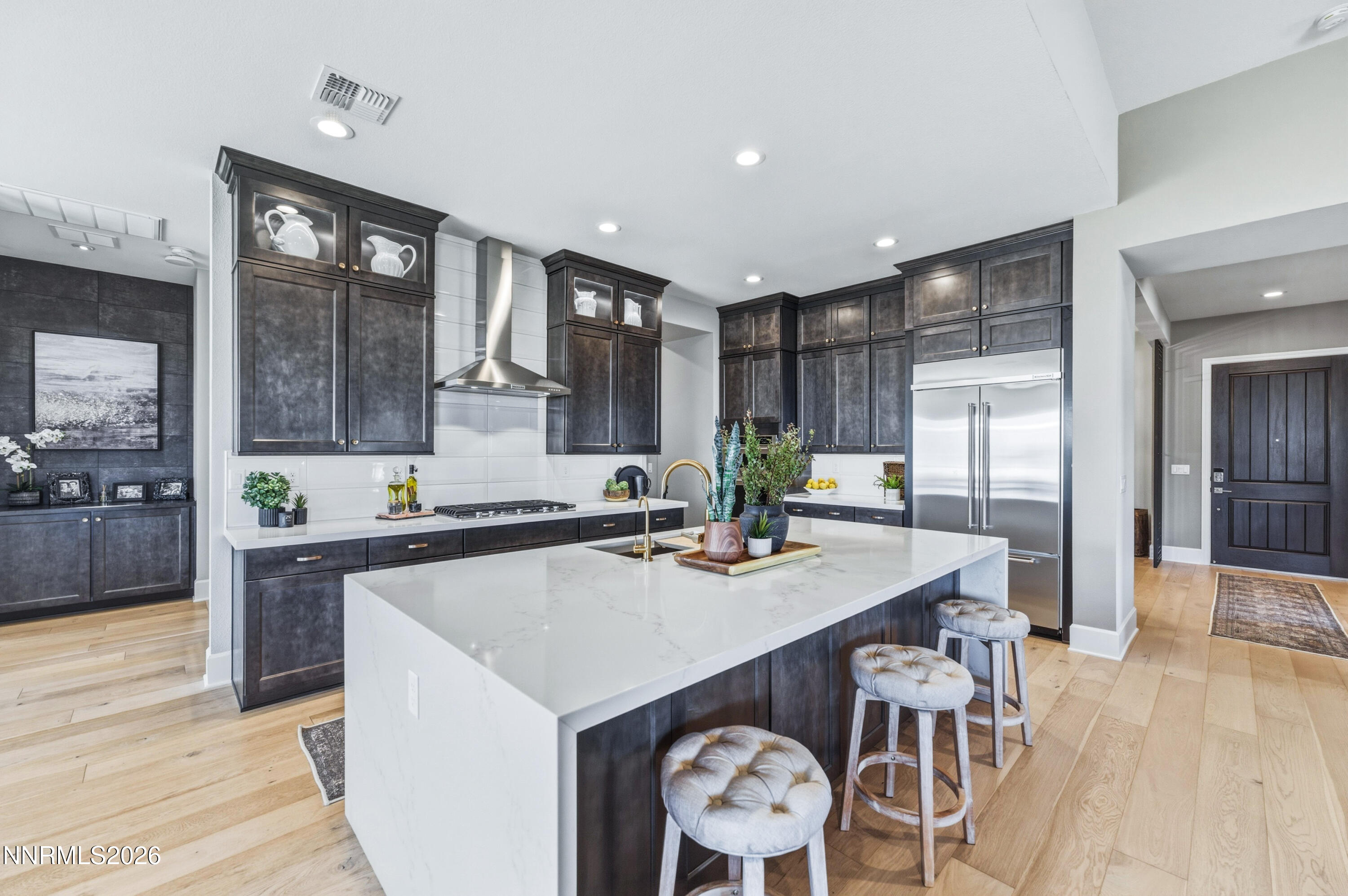 9028 Iron Sky Court Reno, NV 89523 - Photo 7 of 36 a kitchen with a table and chairs in it