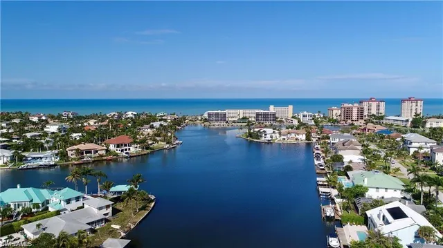 an aerial view of a city with ocean view