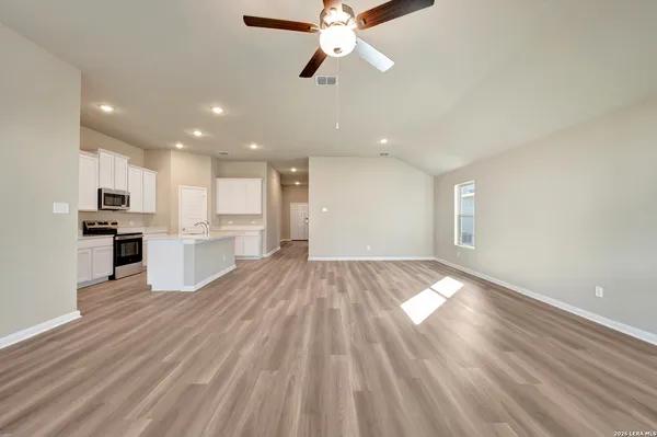 a view of kitchen with granite countertop cabinets and outdoor space