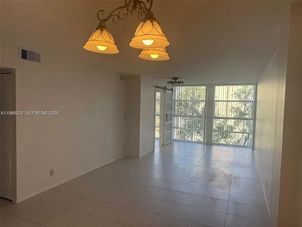 a view of an empty room with a window