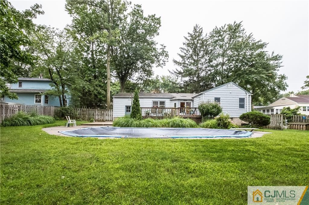190 Normandy Road Edison, NJ 08820 - Photo 22 of 25 a front view of a house with a yard and trees