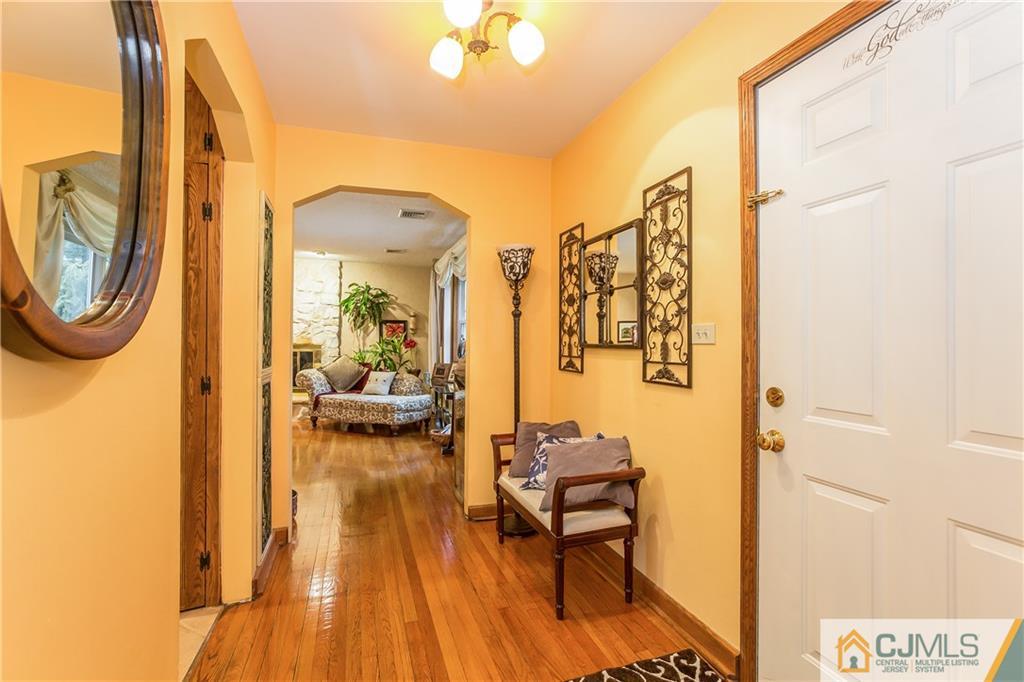 190 Normandy Road Edison, NJ 08820 - Photo 4 of 25 a view of living room filled with furniture and a chandelier