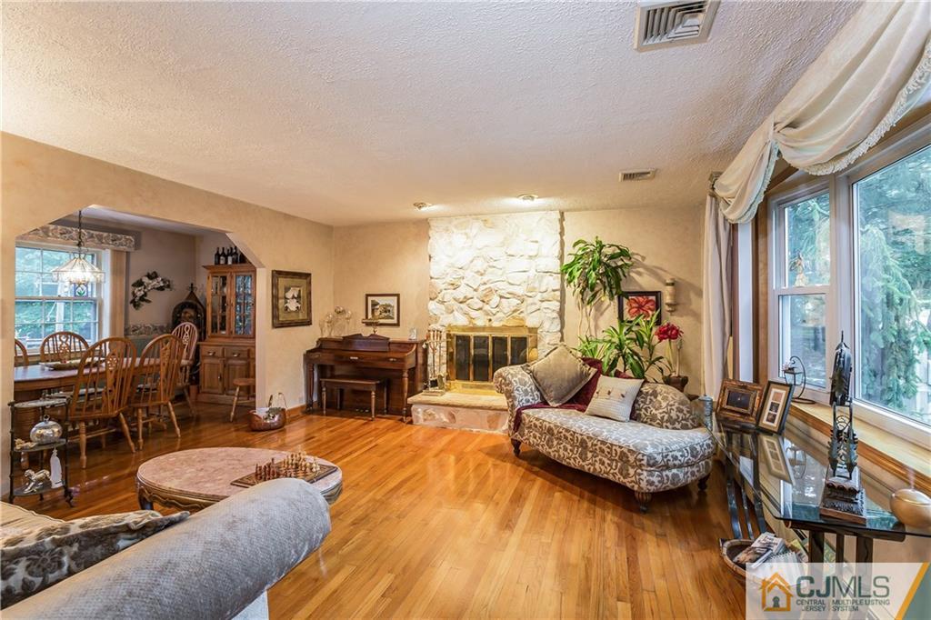 190 Normandy Road Edison, NJ 08820 - Photo 6 of 25 a living room with furniture and a fireplace