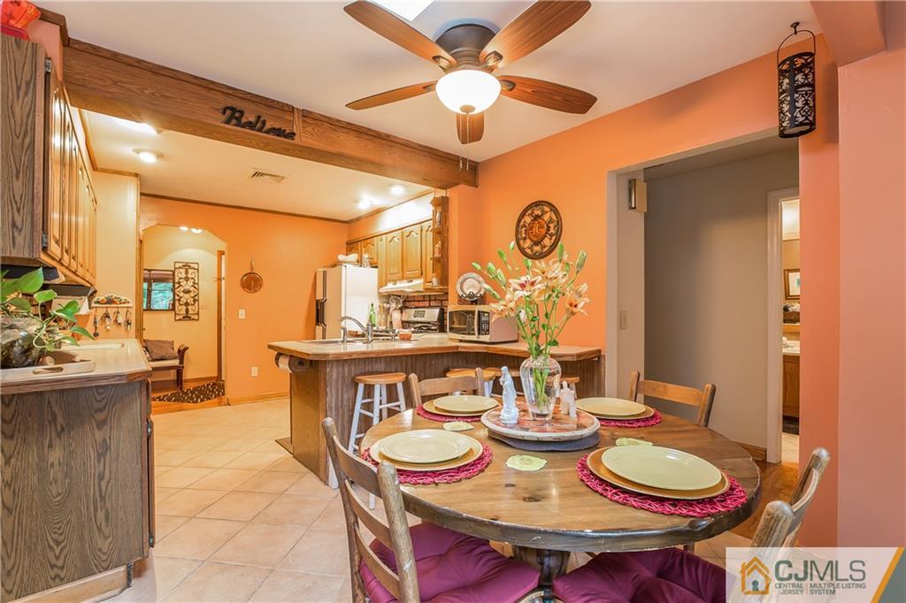 190 Normandy Road Edison, NJ 08820 - Photo 9 of 25 a dining room with furniture and wooden floor