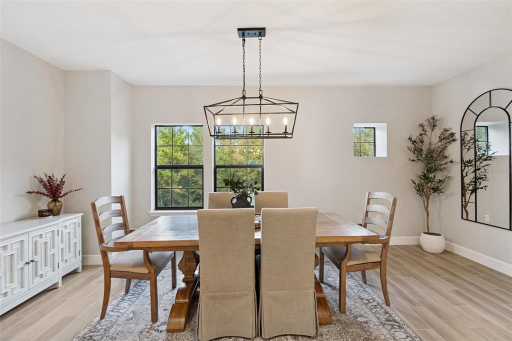 1230 Spotted Sandpiper Loop Winter Springs, FL 32708 - Photo 19 of 52 a view of a dining room with furniture window and wooden floor