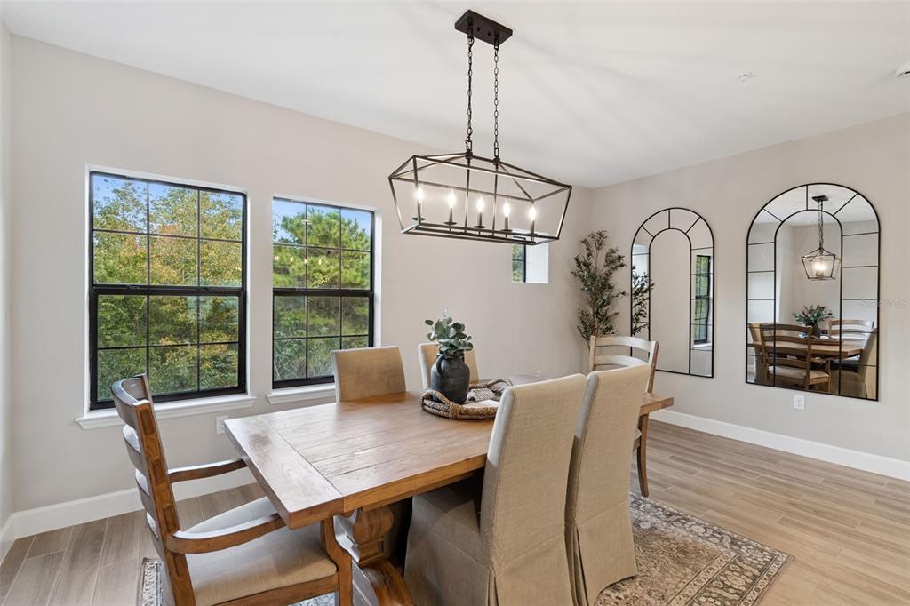 1230 Spotted Sandpiper Loop Winter Springs, FL 32708 - Photo 20 of 52 a view of a dining room with furniture window and wooden floor