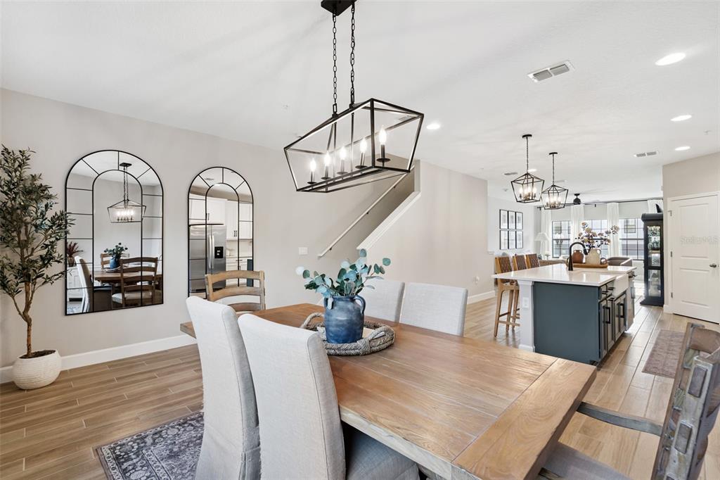 1230 Spotted Sandpiper Loop Winter Springs, FL 32708 - Photo 22 of 52 a view of a dining room with furniture a chandelier and wooden floor