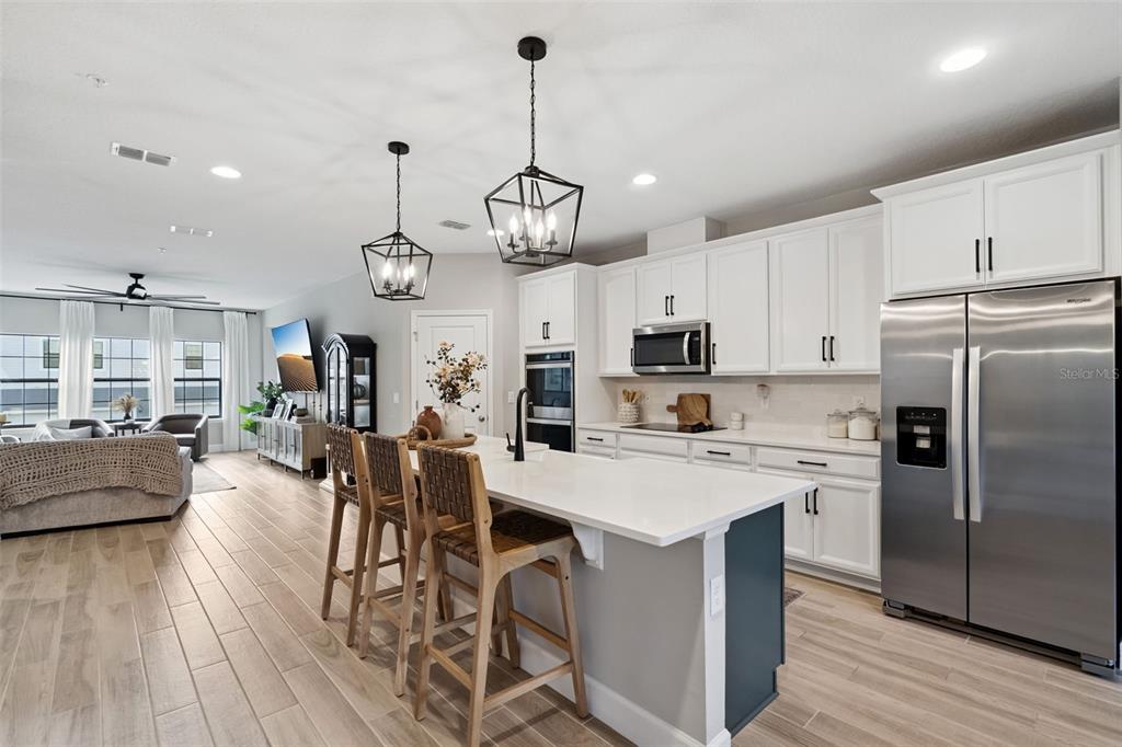 1230 Spotted Sandpiper Loop Winter Springs, FL 32708 - Photo 25 of 52 a view of a kitchen and dining table with chairs