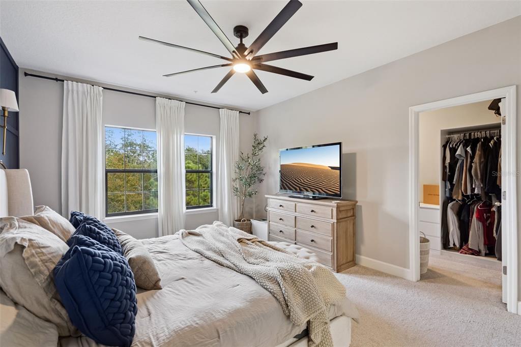 1230 Spotted Sandpiper Loop Winter Springs, FL 32708 - Photo 29 of 52 a bedroom with a bed and a flat screen tv