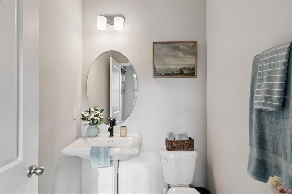 1230 Spotted Sandpiper Loop Winter Springs, FL 32708 - Photo 40 of 52 a bathroom with a toilet sink and mirror