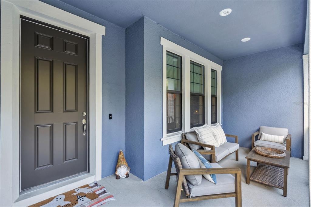1230 Spotted Sandpiper Loop Winter Springs, FL 32708 - Photo 4 of 52 a view of a room that has a couch and a dining table in it