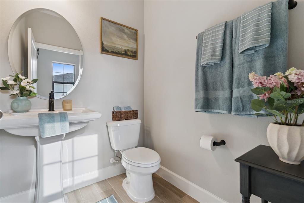 1230 Spotted Sandpiper Loop Winter Springs, FL 32708 - Photo 41 of 52 a bathroom with a toilet sink and mirror