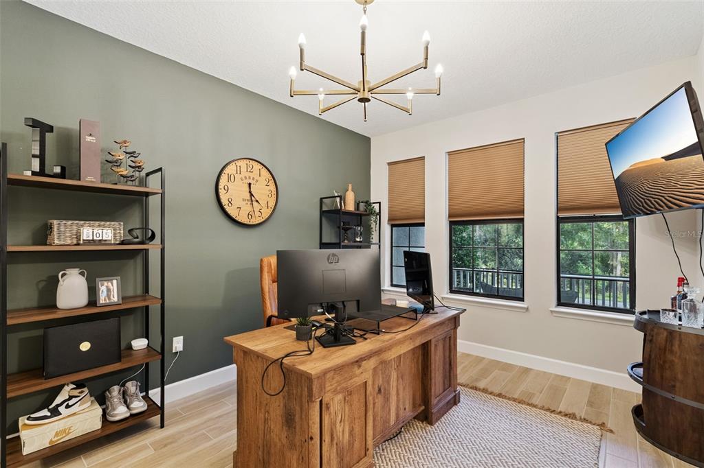 1230 Spotted Sandpiper Loop Winter Springs, FL 32708 - Photo 8 of 52 a view of a workspace with furniture and a window