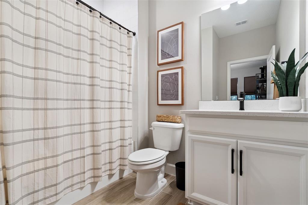 1230 Spotted Sandpiper Loop Winter Springs, FL 32708 - Photo 10 of 52 a bathroom with a sink toilet and shower