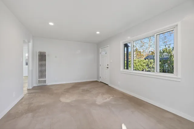 an empty room with windows