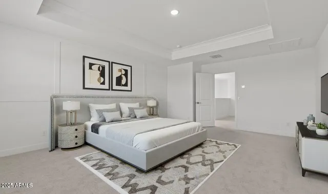 a bedroom with a bed and a couch