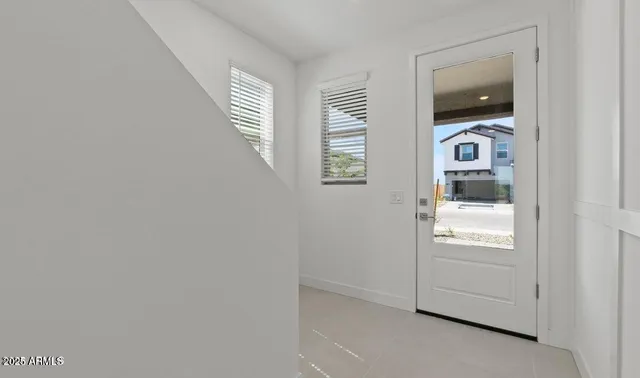 a view of an entryway with wooden floor