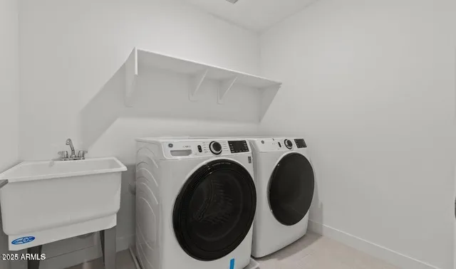a utility room with dryer and washer