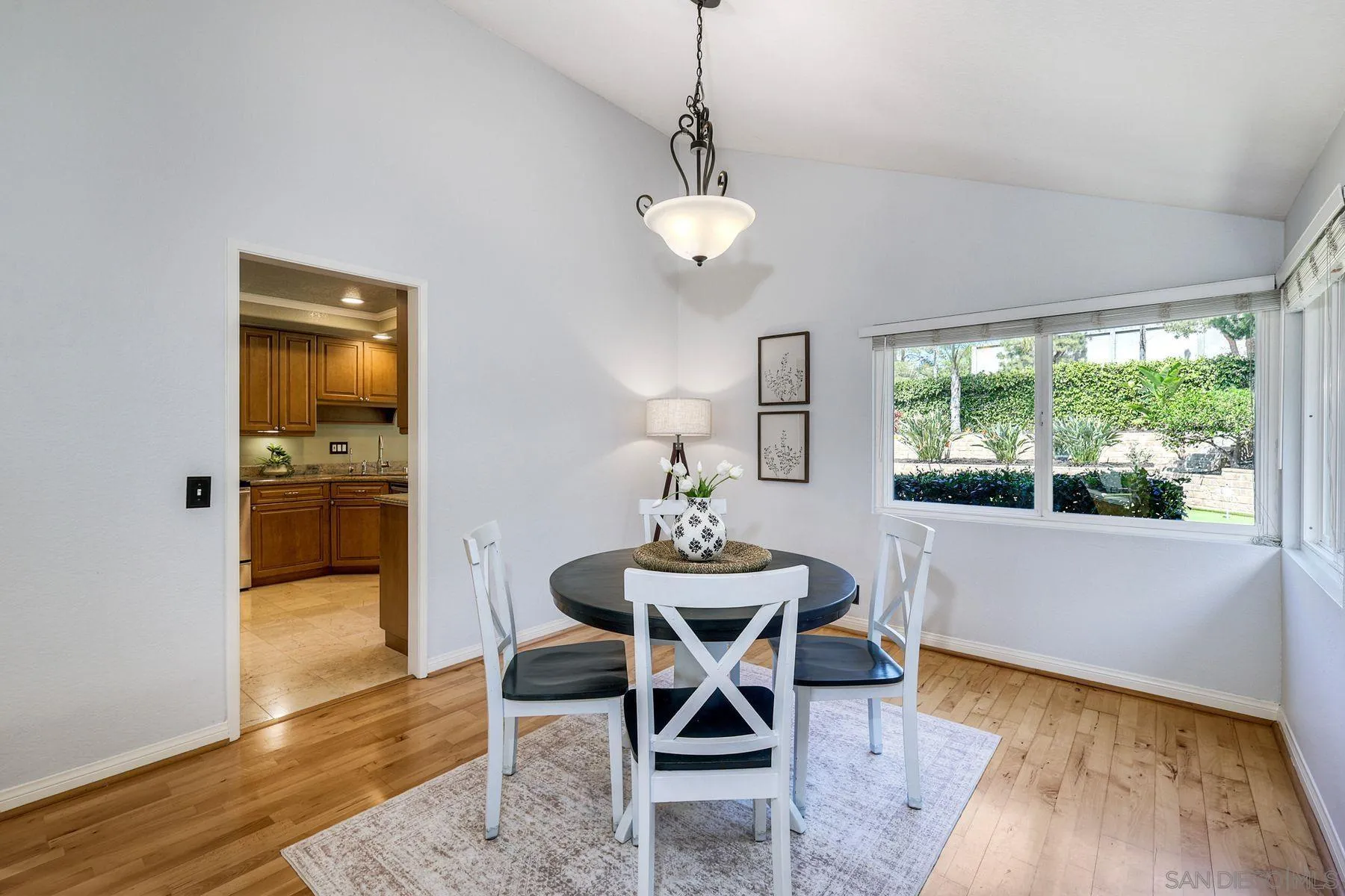 13976 Country Creek Road Poway, CA 92064 - Photo 6 of 40 a view of a dining room with furniture window and wooden floor
