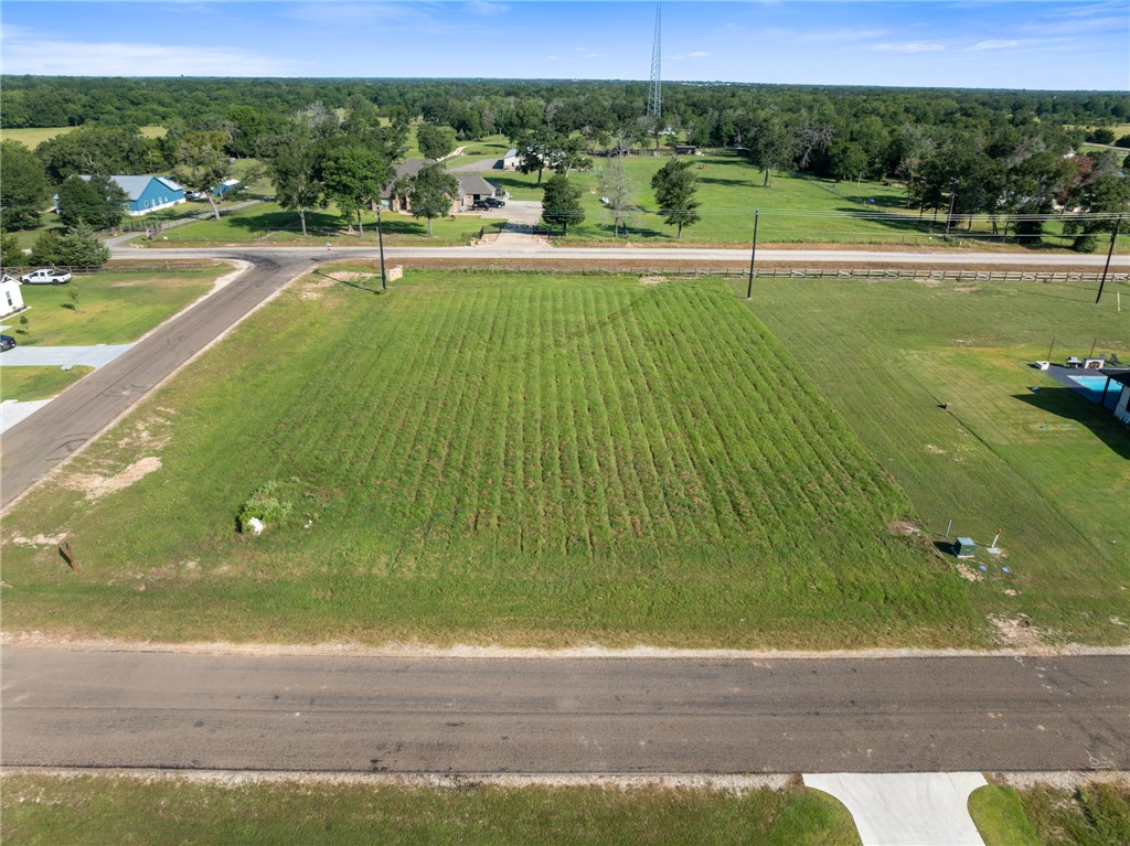 a view of a swimming pool with a yard