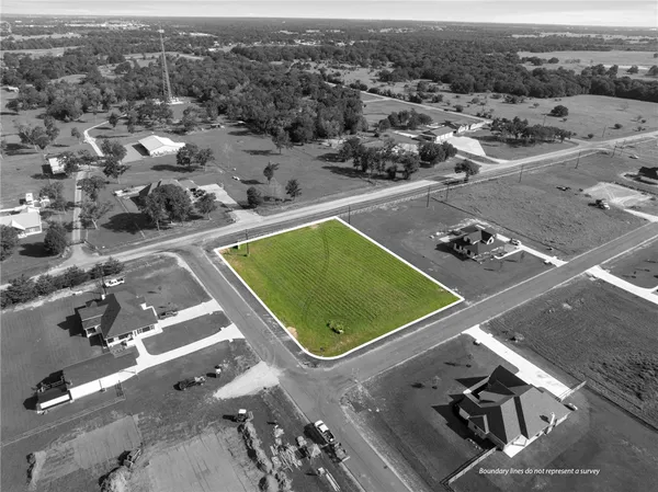 an aerial view of a residential houses with outdoor space