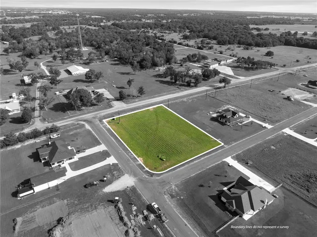 an aerial view of a residential houses with outdoor space
