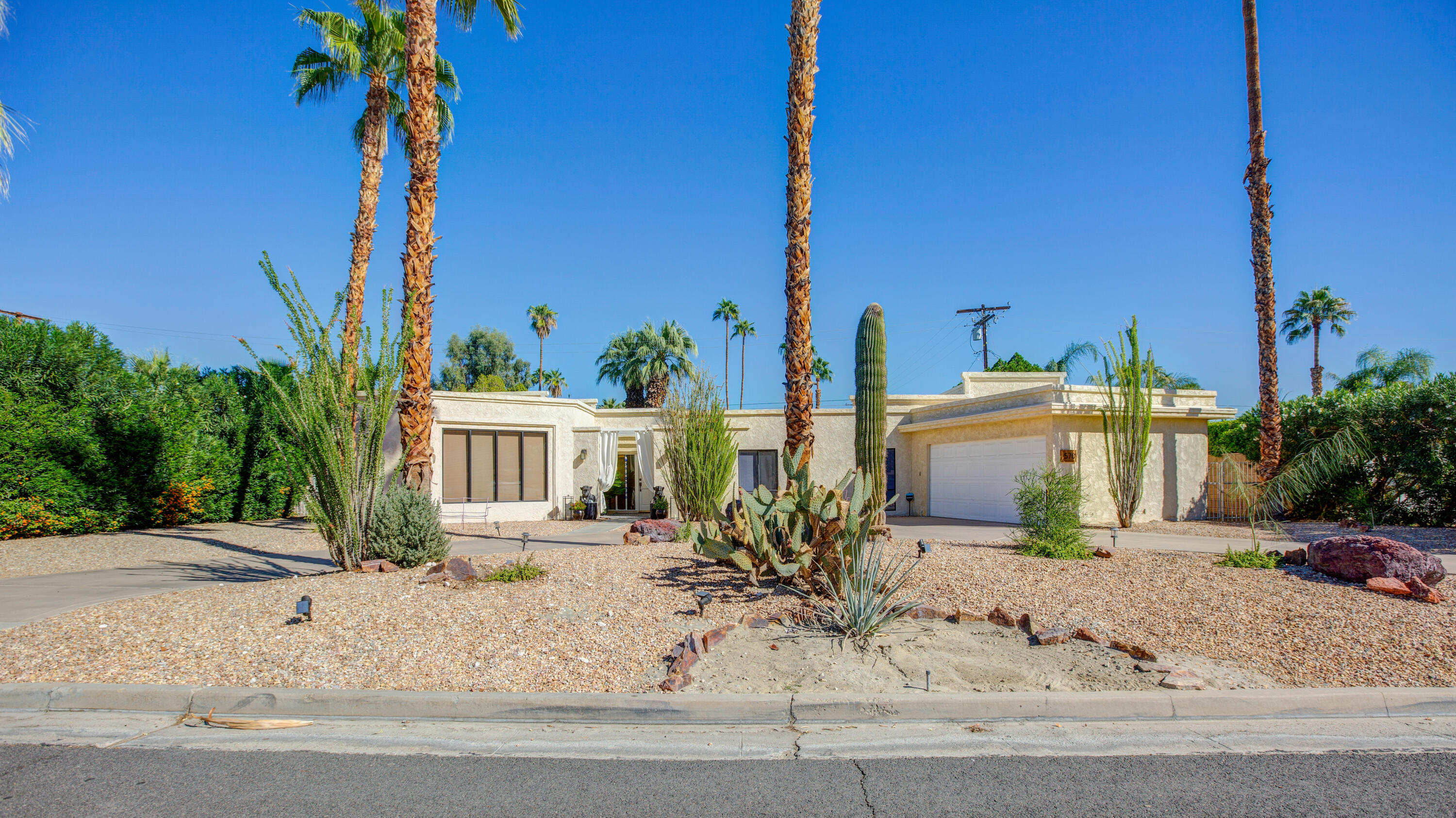570 South Compdre Road Palm Springs, CA 92264 - Photo 1 of 3 a view of a house with a small yard