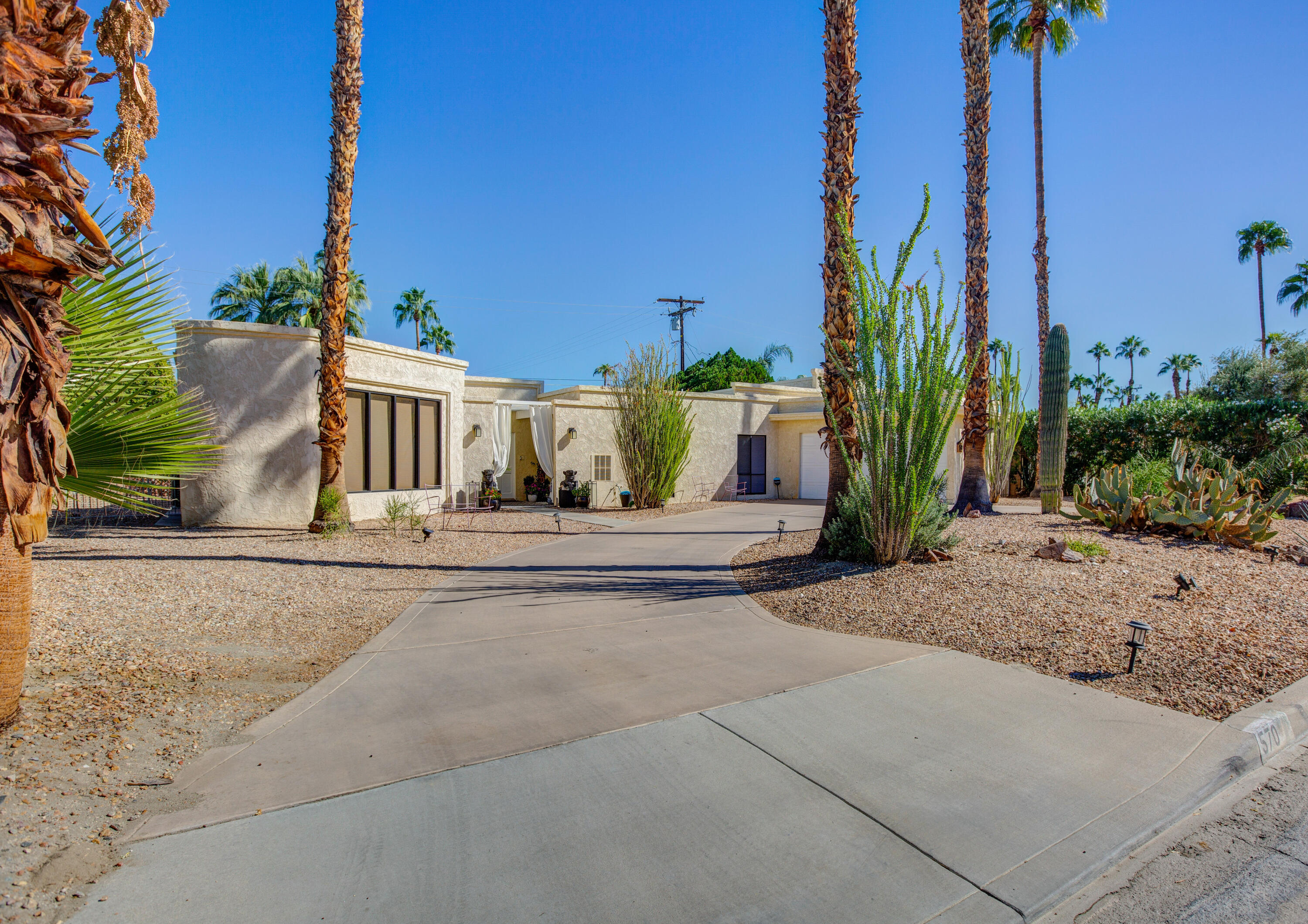 570 South Compdre Road Palm Springs, CA 92264 - Photo 2 of 3 a view of a street with palm trees