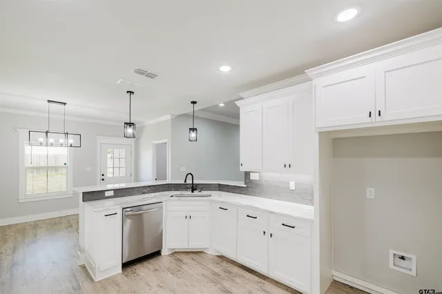 a kitchen with stainless steel appliances granite countertop a stove and a sink
