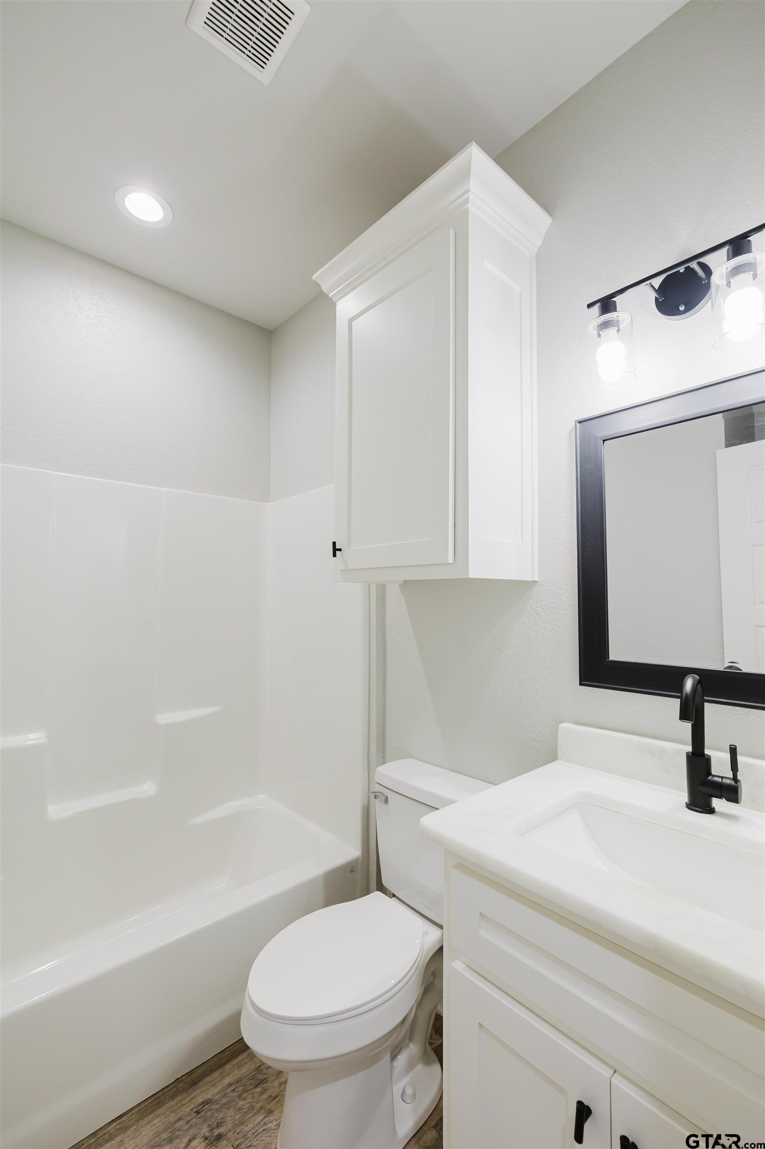 11051 Happy Acres Tyler, TX 75706 - Photo 29 of 36 a bathroom with a sink a toilet and a bathtub