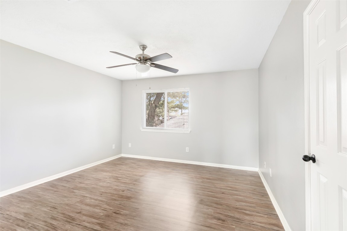 31315 Copperleaf Drive Spring, TX 77386 - Photo 27 of 34 a view of a big room with wooden floor and a chandelier fan
