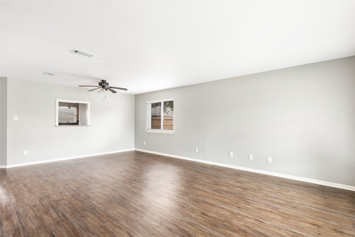 31315 Copperleaf Drive Spring, TX 77386 - Photo 6 of 34 an empty room with wooden floor and windows