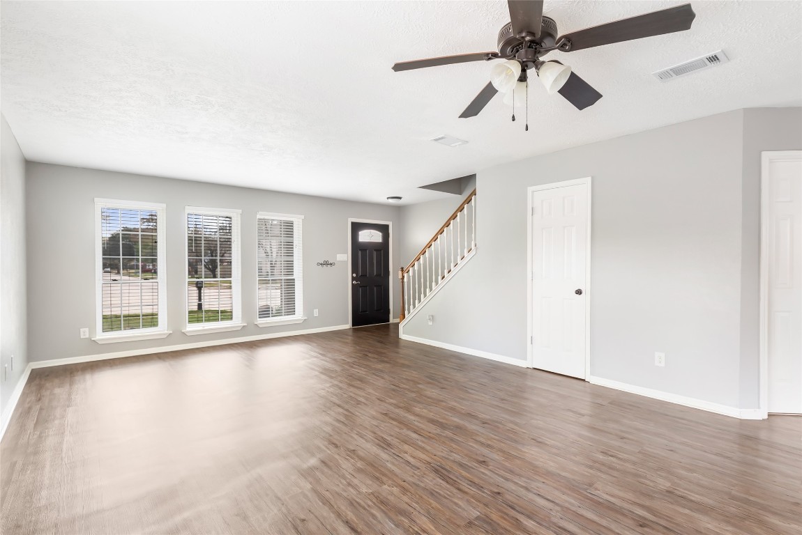 31315 Copperleaf Drive Spring, TX 77386 - Photo 8 of 34 a view of an empty room with wooden floor and a window