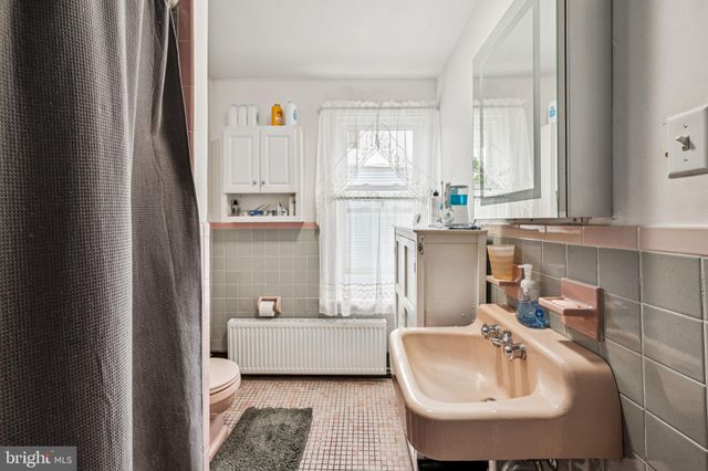 a bathroom with a sink toilet and tub