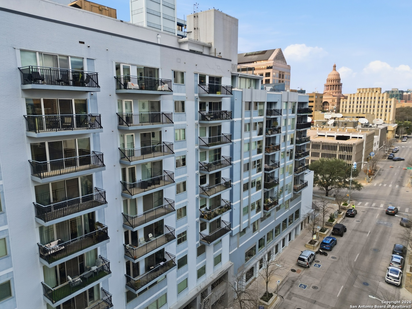 800 Brazos Street, Unit 1103 Austin, TX 78701 - Photo 24 of 26 a view of a building with a lot of windows