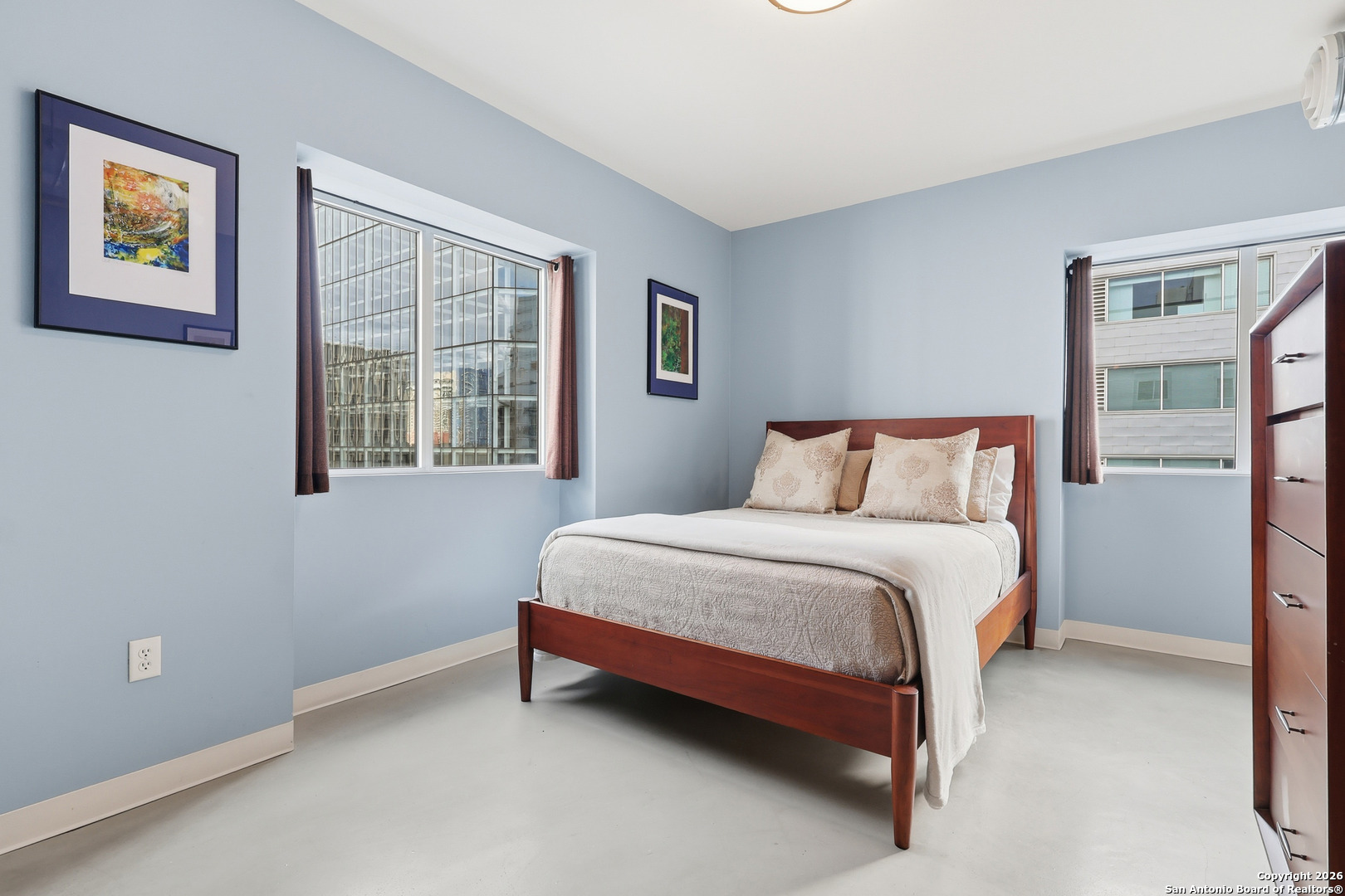 800 Brazos Street, Unit 1103 Austin, TX 78701 - Photo 3 of 26 a bedroom with a bed and a window