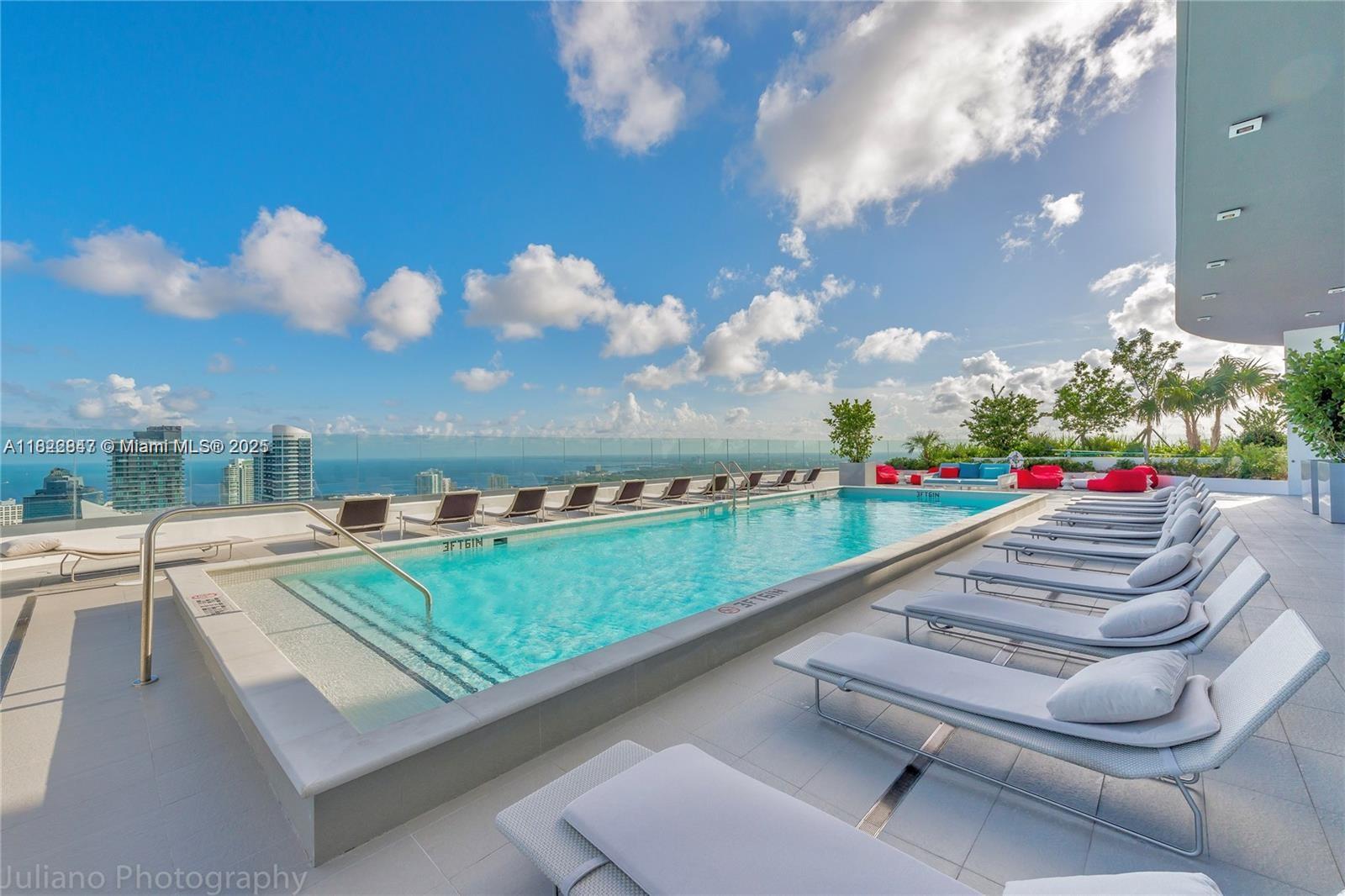 45 Southwest 9th Street, Unit 3403 Miami, FL 33130 - Photo 23 of 27 a view of swimming pool from a balcony