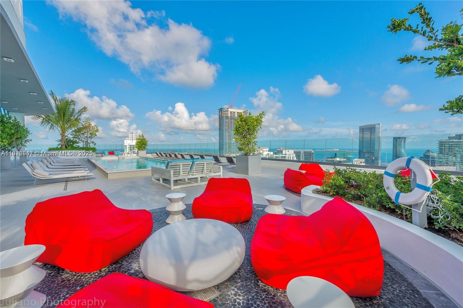 45 Southwest 9th Street, Unit 3403 Miami, FL 33130 - Photo 26 of 27 a view of an outdoor space and a fire pit