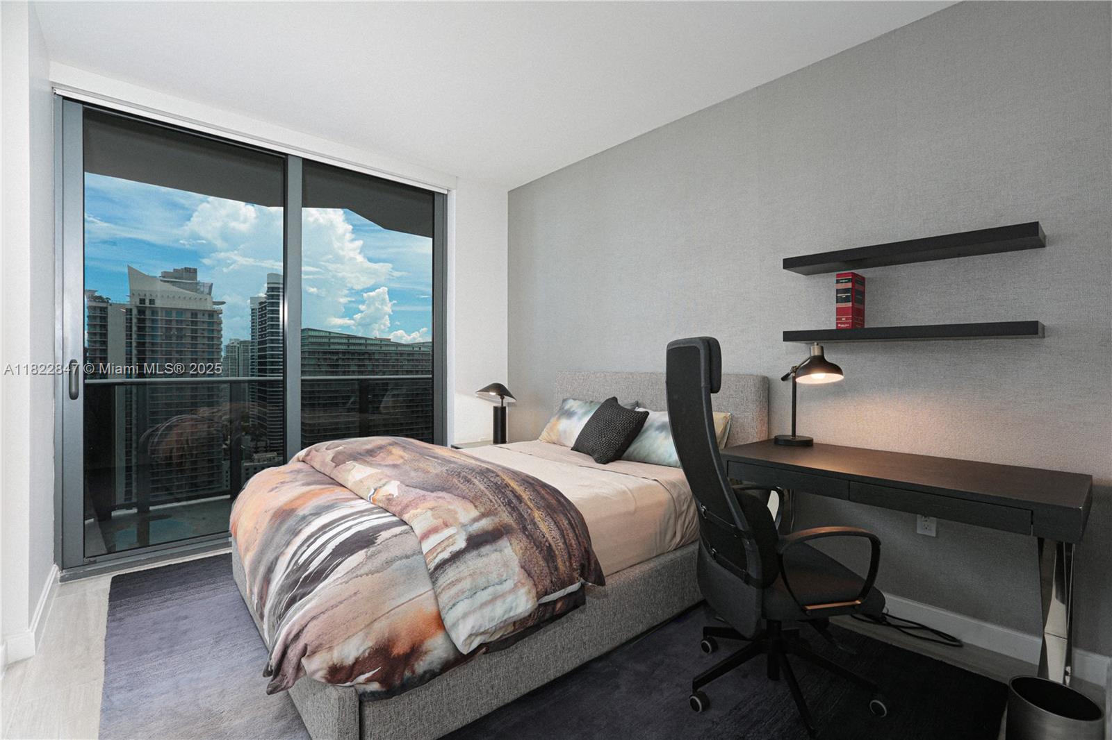 45 Southwest 9th Street, Unit 3403 Miami, FL 33130 - Photo 5 of 27 a bedroom with a bed and with desk