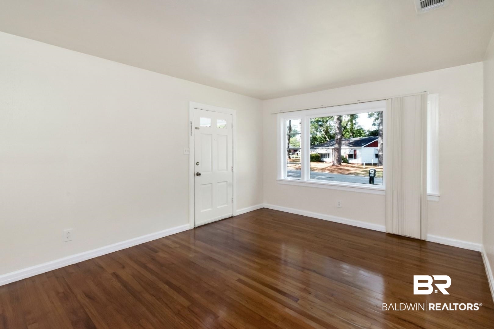 1477 Fairfield Street Mobile, AL 36606 - Photo 11 of 34 Unfurnished room with dark wood-type flooring