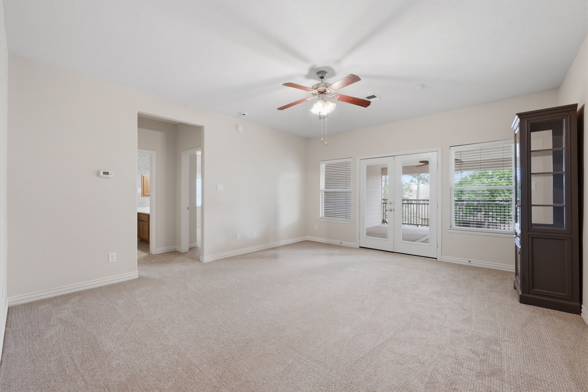 315 Arbor Ridge Lane Conroe, TX 77384 - Photo 26 of 48 wooden floor in an empty room with a window