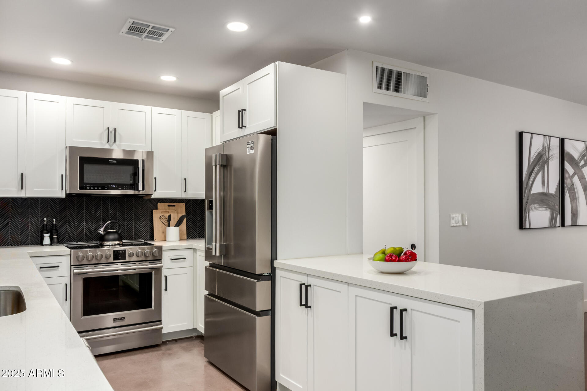 4735 North 24th Street Phoenix, AZ 85016 - Photo 11 of 44 a kitchen with white cabinets and white appliances