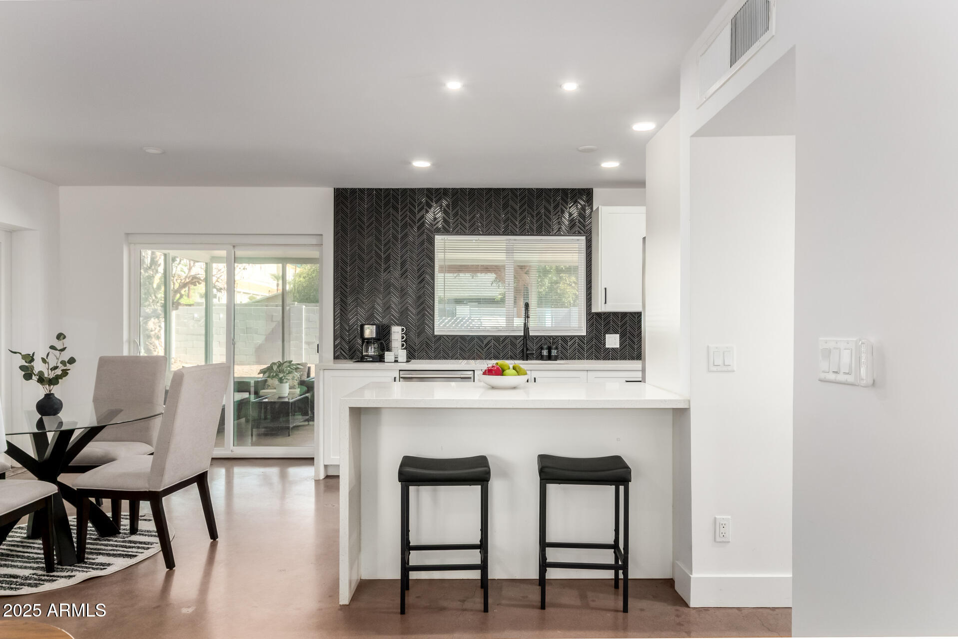 4735 North 24th Street Phoenix, AZ 85016 - Photo 13 of 44 a kitchen with a table and chairs in it