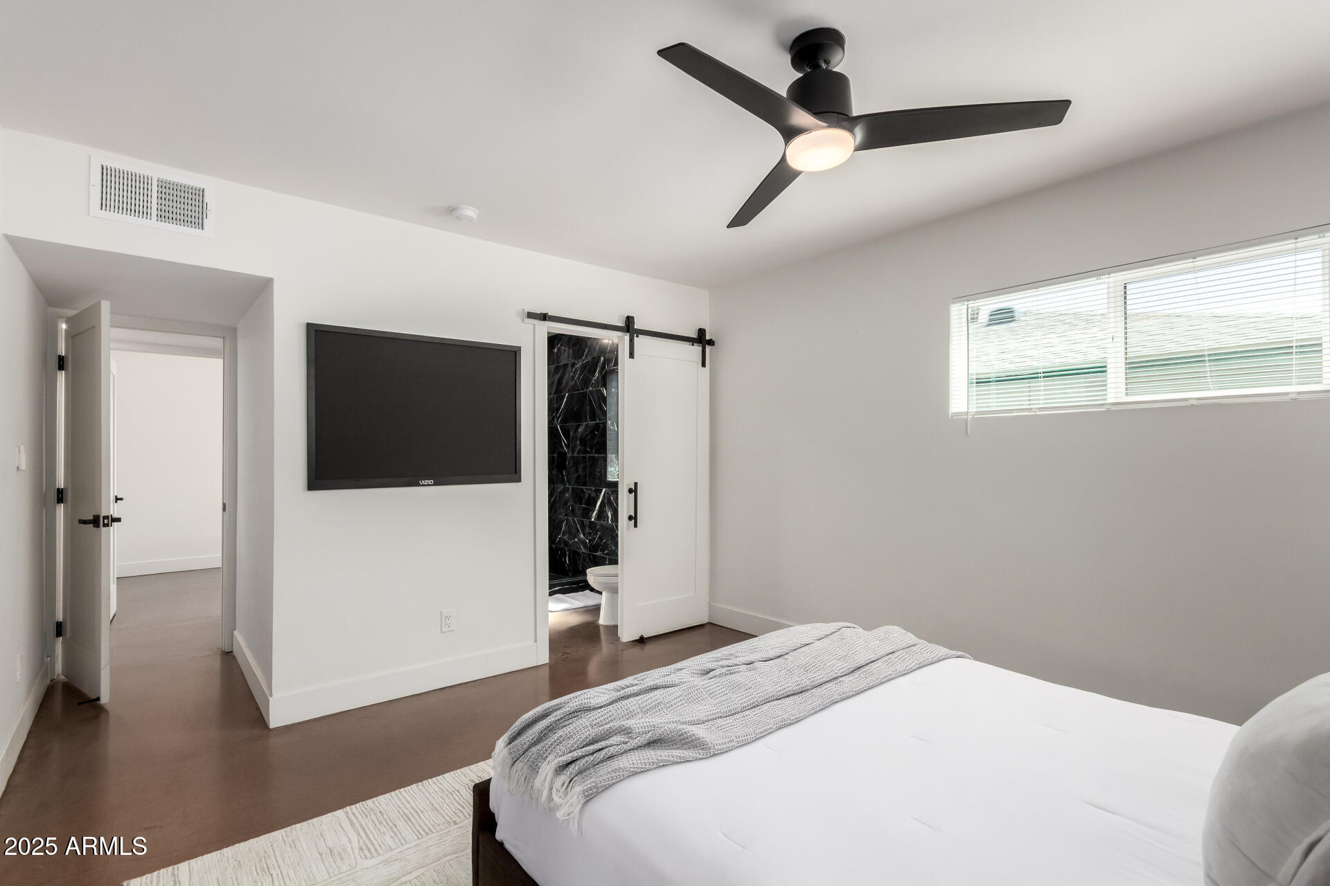 4735 North 24th Street Phoenix, AZ 85016 - Photo 16 of 44 a bedroom with a bed and a walk in closet